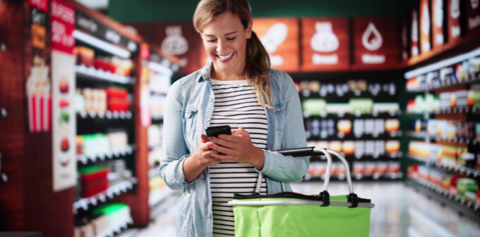 happy customer on phone while shopping